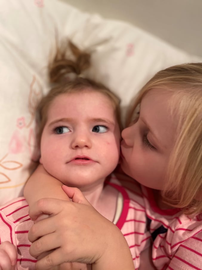 Lola and Daisy share kiss